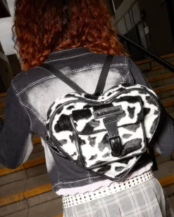 Accessories|Bags>Dr. Martens Heart Shaped Faux Fur Cow Print Backpack BLACK+WHITE — Cow Print + Kiev